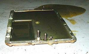 308 gearbox pan with springs, balls, and spacer.jpg